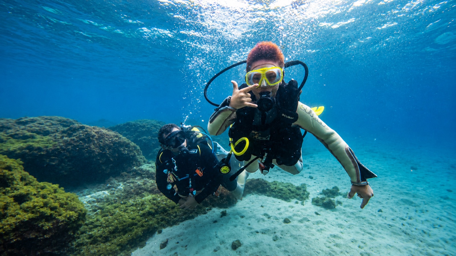 Two scuba divers exploring the reef off Marbella