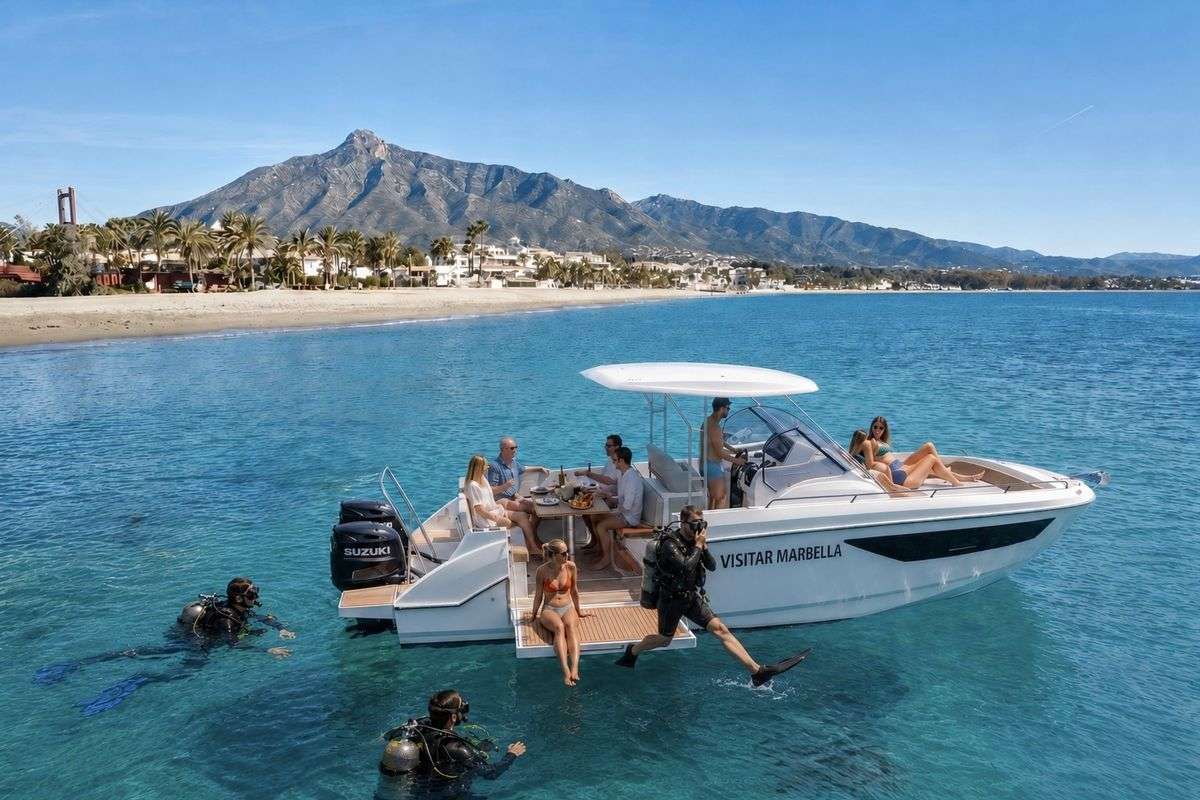 The Visitar Marbella boat, a stable open-deck dive support vessel